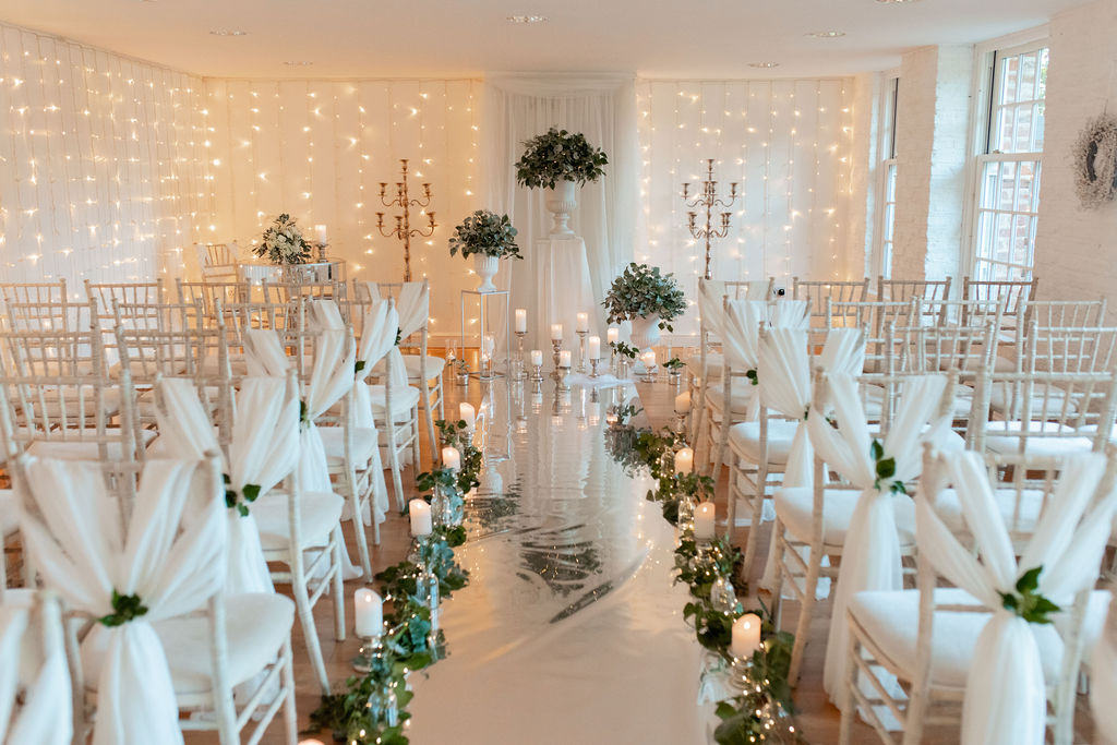 ceremony room lit by candles and fairy lights